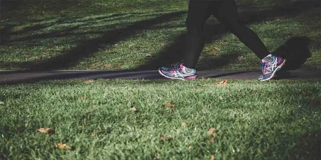 a girl walking on the streets tracking steps